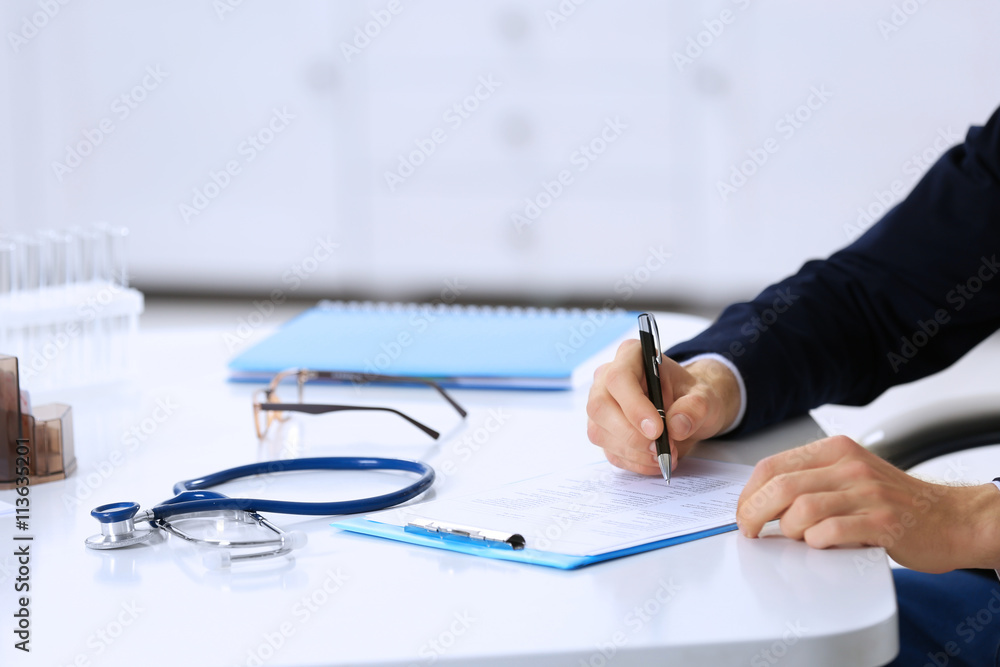 Doctor working at his workplace in hospital Doctor working at his workplace in hospital