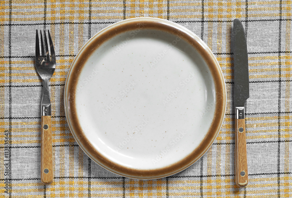 Empty plate, fork and knife Empty plate, fork and knife