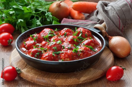 Meatballs in tomato sauce / Delicious chicken or turkey meatballs with rice, vegetable and  tomato sauce in frying pan