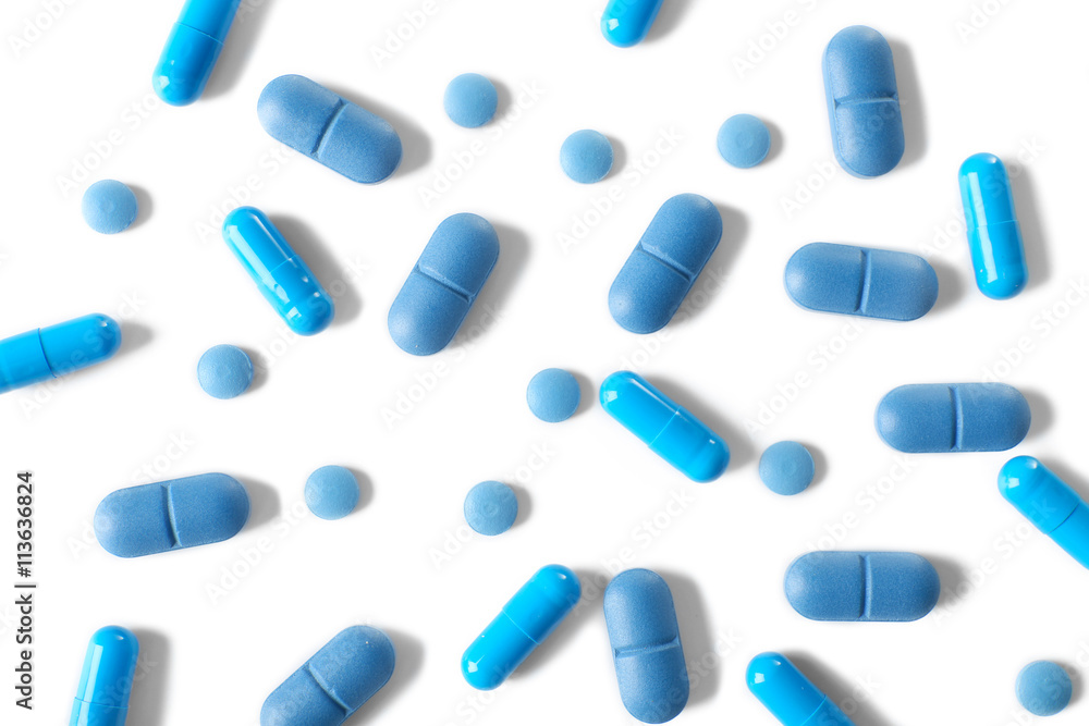 Heap of pills on white table Heap of pills on white table