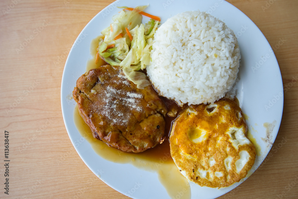pork steak and fried egg with rice 
