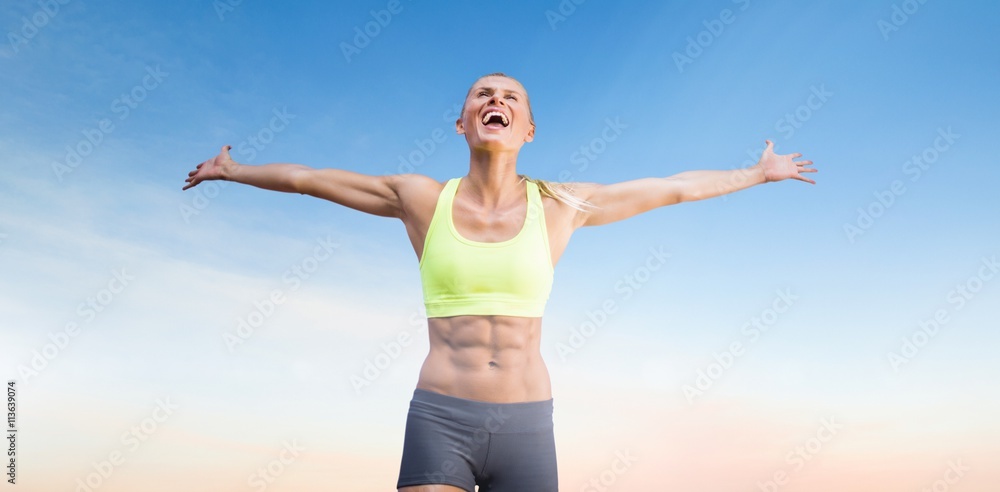 Composite image of fit woman celebrating victory with arms stretched Composite image of fit woman celebrating victory with arms stretched