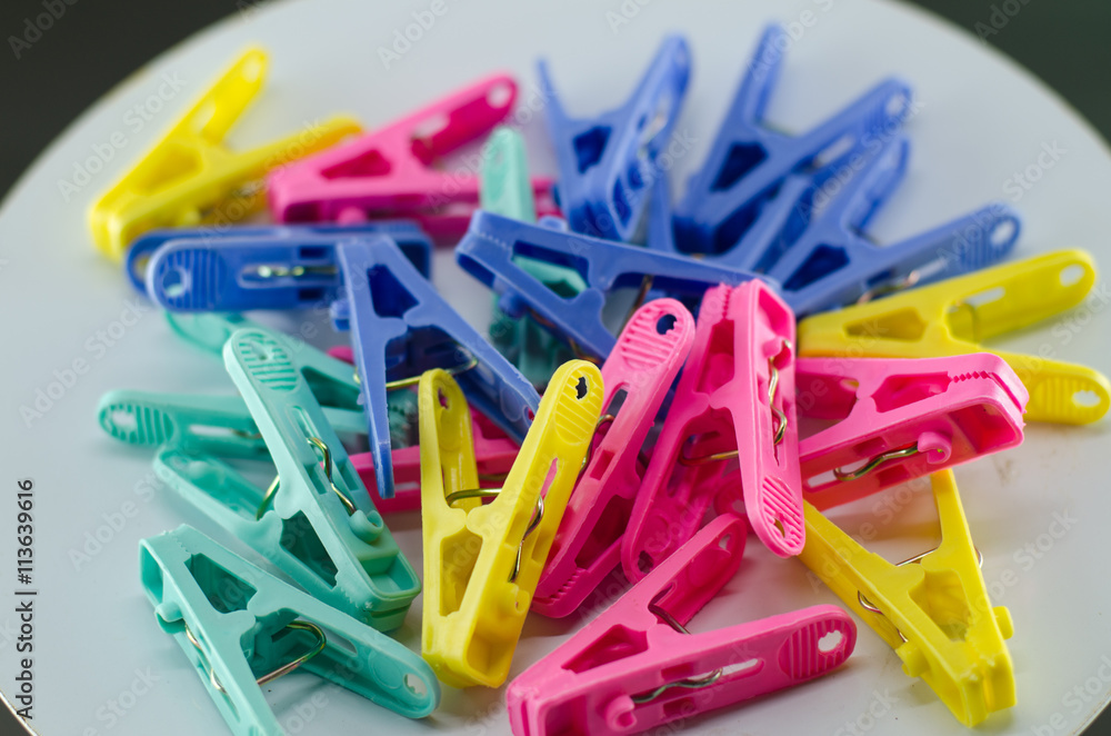 Lots of clothespins on a white background Lots of clothespins on a white background
