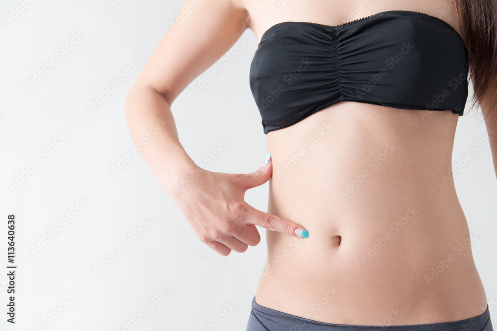 お腹を触る女性・白バック お腹を触る女性・白バック