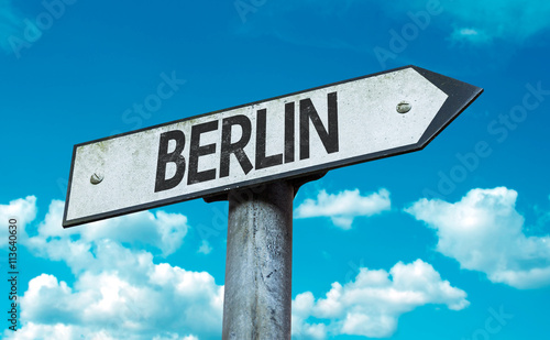 Canvas Print Berlin direction sign in a concept image