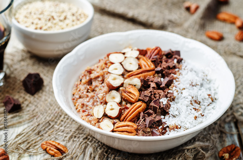 Chocolate Quinoa breakfast bowl decorated with hazelnuts, Pecan,
