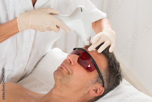 Man Receiving Laser Epilation Treatment