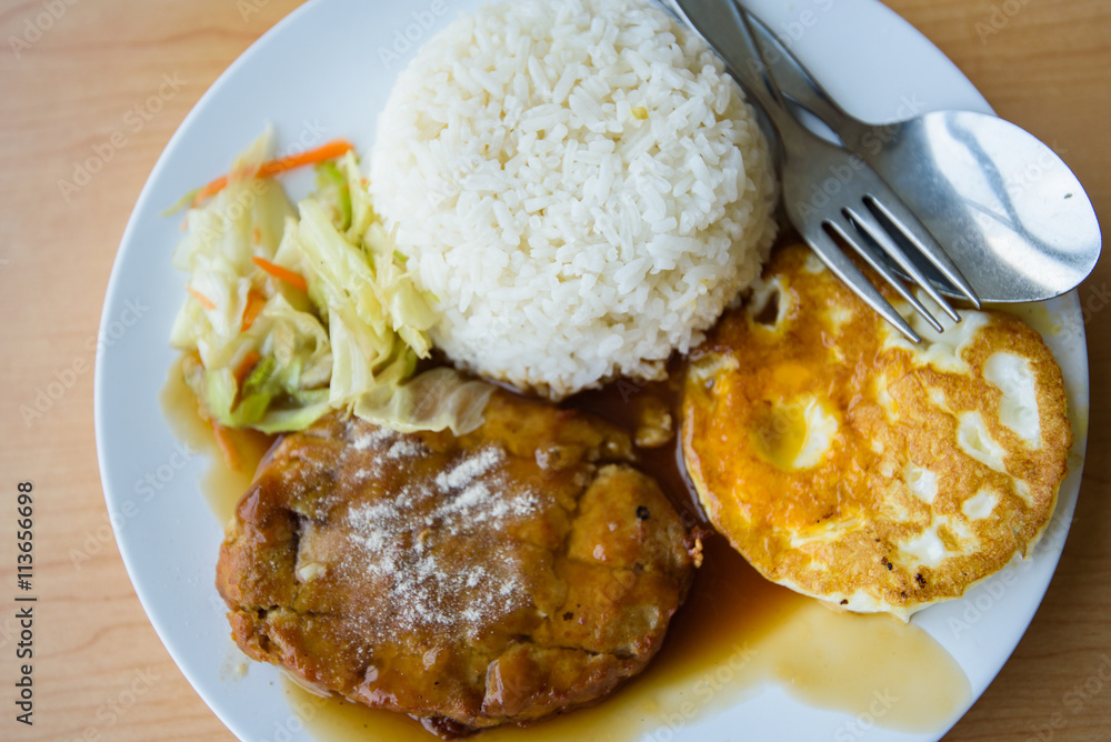 pork steak and fried egg with rice 