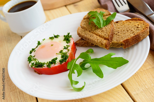 Scrambled eggs, baked in a ring bell pepper, toast, arugula leaves and a cup of coffee. Light breakfast.