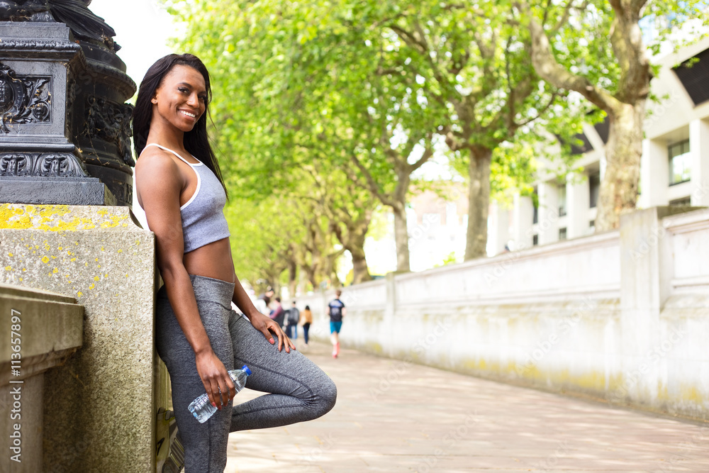 Fototapeta premium fitness woman holding a bottle of water