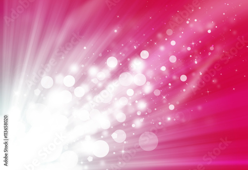 Pink glitter sparkle defocused rays lights bokeh beautiful abstract background.