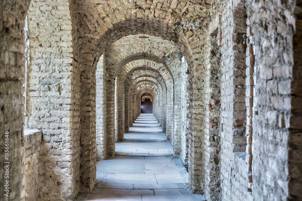 Castle tunnel with a series of arches in the ruined Bastion fortress in the Slovak city of Komarno.