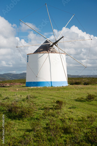 Traditional portuguese windmill near Odeceixe Aljezur in springtime, Algarve, Portugal