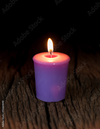 lavender candle on old wood