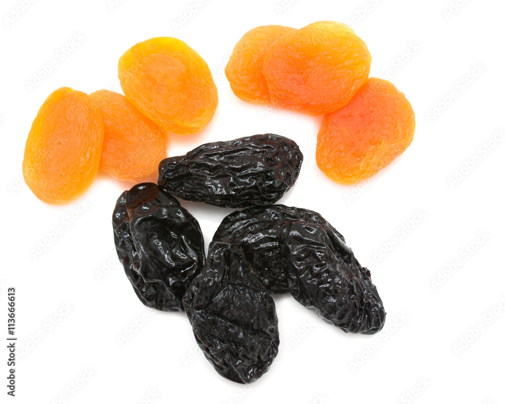 prunes and dried apricots on a white background prunes and dried apricots on a white background