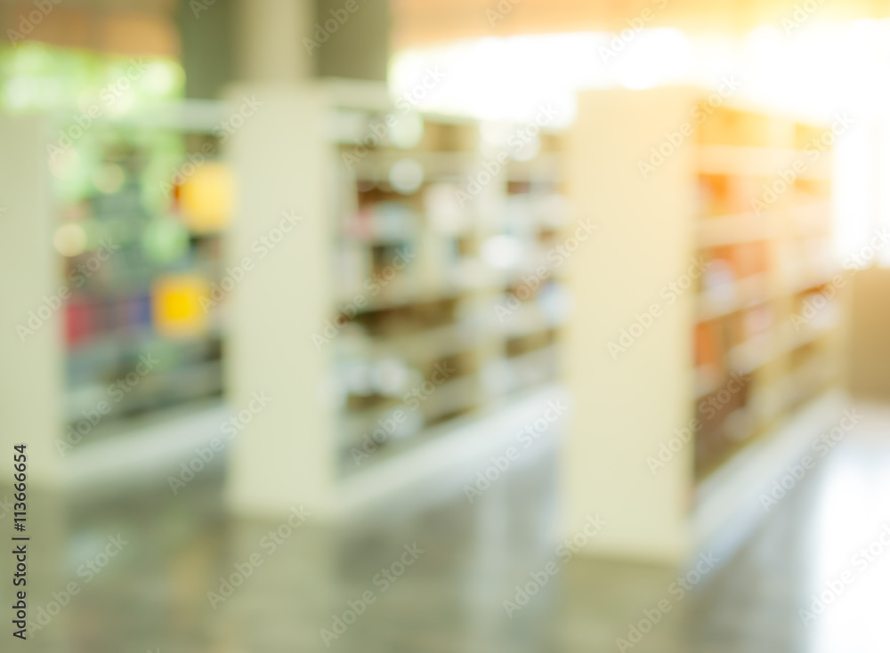 books on bookshelf in library, abstract blur defocused backgroun