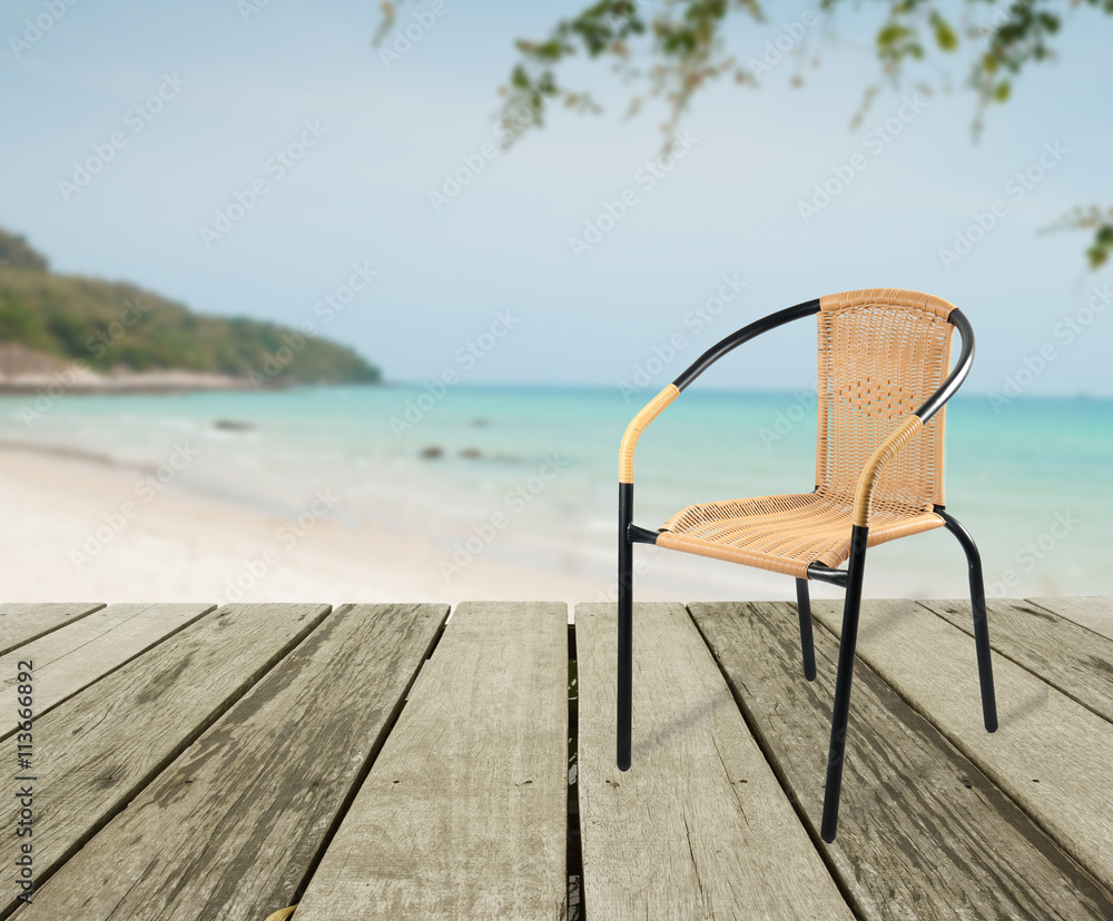 artificial rattan chair on wood,sea view background