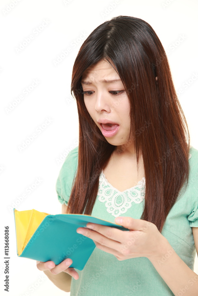 poor young Japanese woman wearing a green dress poor young Japanese woman wearing a green dress