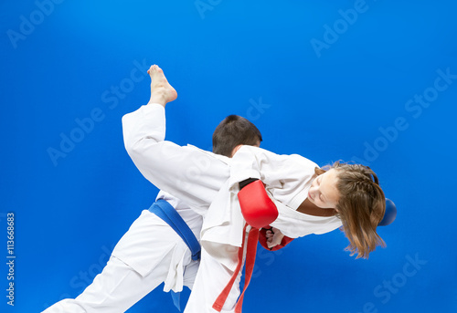 Sportswoman performs a roundhouse kick to the head foot