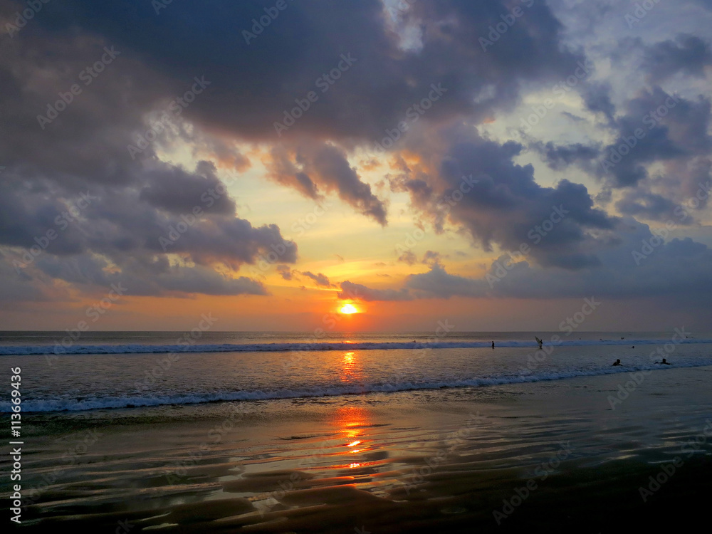 Beautiful sunset sky with reflection at Kuta beach, Bali