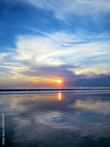 Beautiful sunset sky with reflection at Kuta beach, Bali © art_of_sun