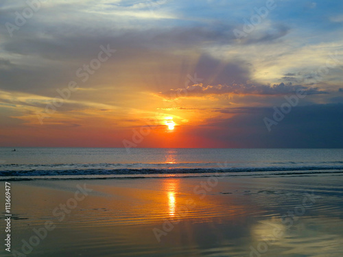 Beautiful sunset sky with reflection at Kuta beach  Bali