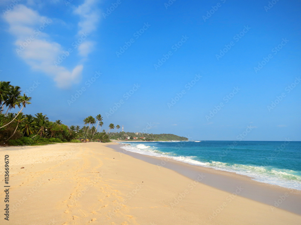 Empty clean beach with palms, Kamburugamuwa, Mirissa, Sri Lanka