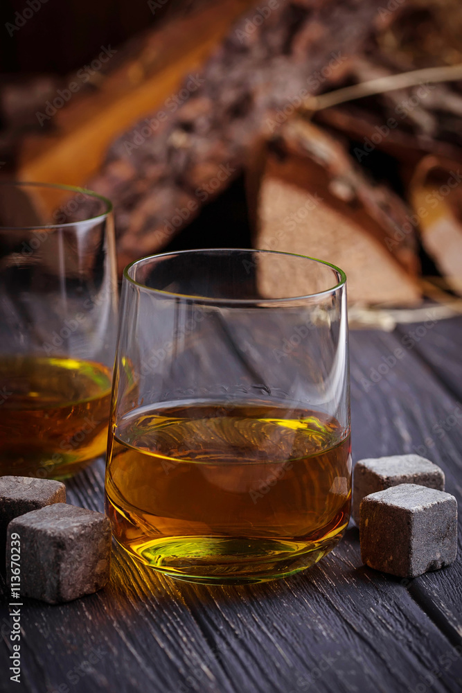 Glass of whiskey with stones Glass of whiskey with stones