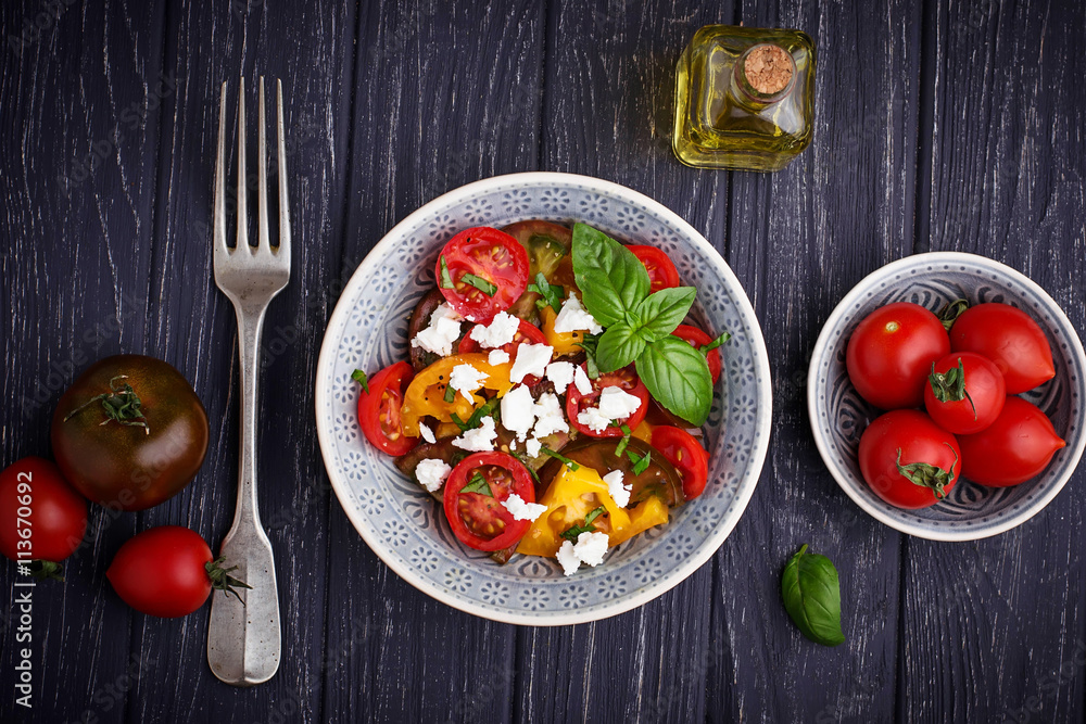 Colorful tomatoes salad with feta cheese