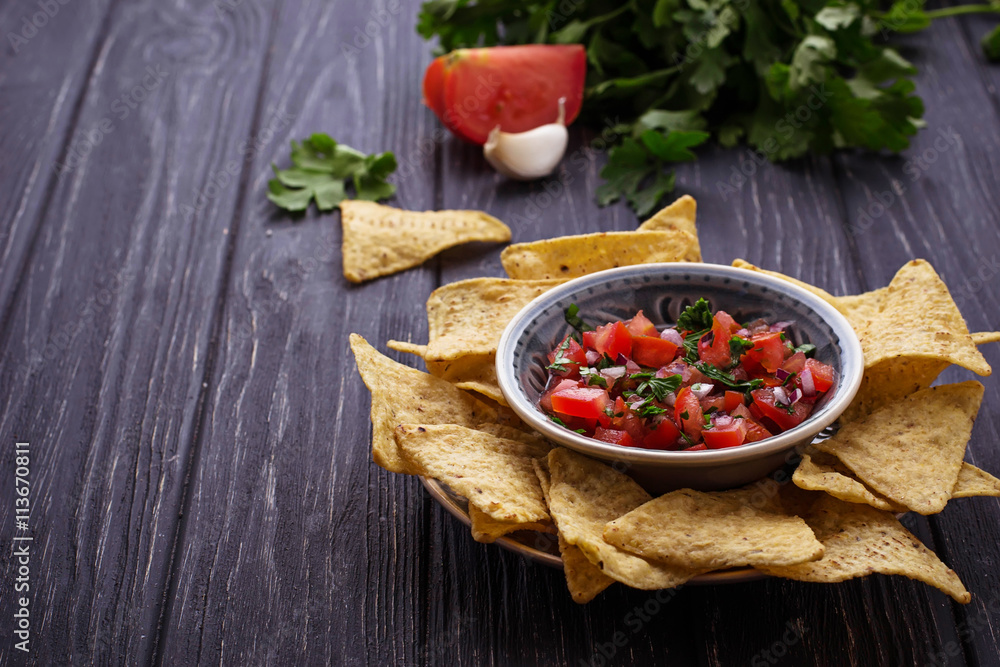 Mexican corn chips nachos with salsa dip Mexican corn chips nachos with salsa dip