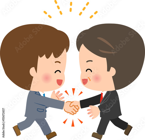 勢いよく握手するスーツの男性