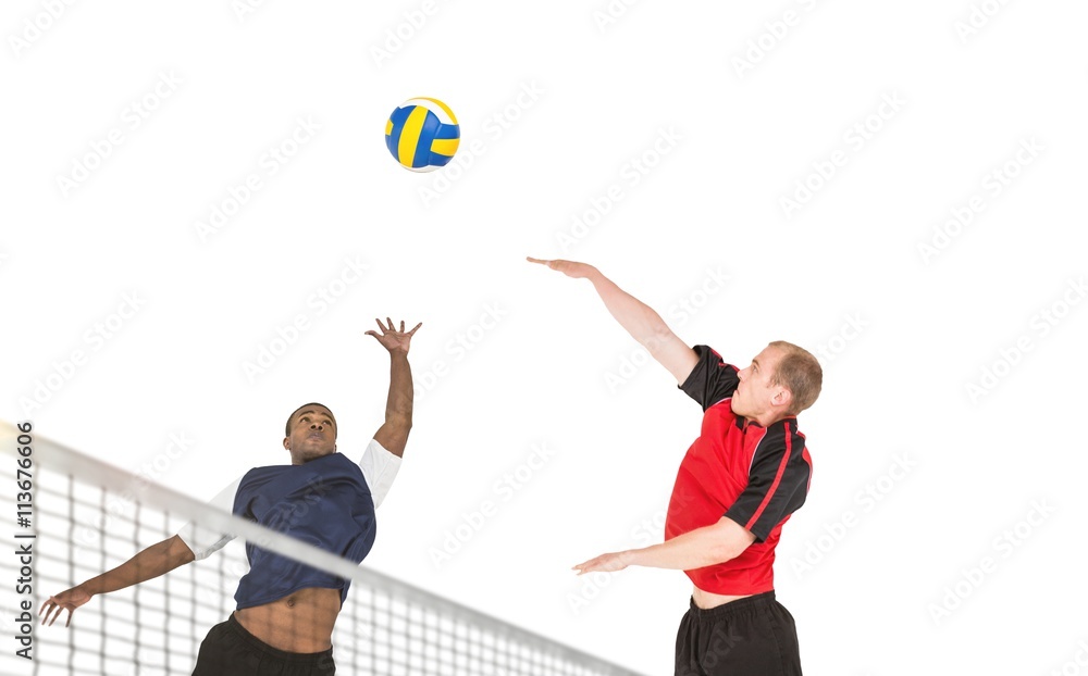 Composite image of sportsman posing while playing volleyball Composite image of sportsman posing while playing volleyball