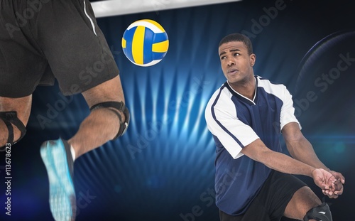 Composite image of rear view of sportsman posing while playing volleyball
