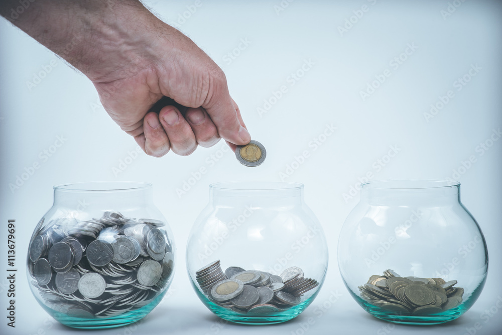 Money in a hand, saving, money box Money in a hand, saving, money box