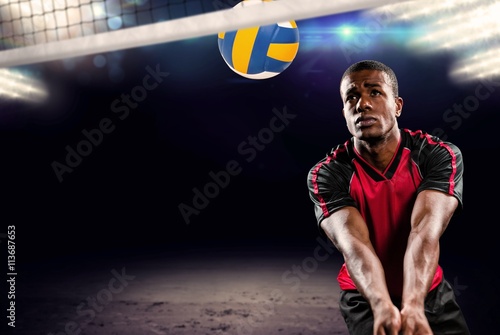 Composite image of sportsman playing volleyball