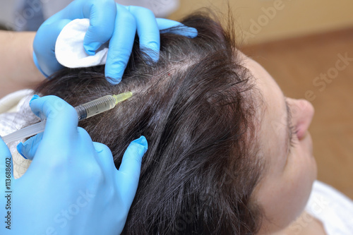 Anti hair loss injection in clinic.
