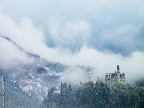 Old castle in mountais, rocks and forest covered  snow and hoarfrost © rdonar