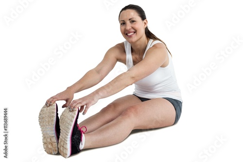 Portrait of athlete woman doing stretching exercise