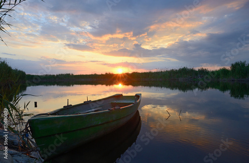 fisherman boat at sunset