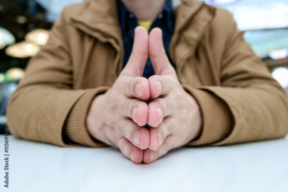 Man with crossed fingers
