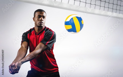 Fototapeta Naklejka Na Ścianę i Meble -  Composite image of sportsman playing volleyball