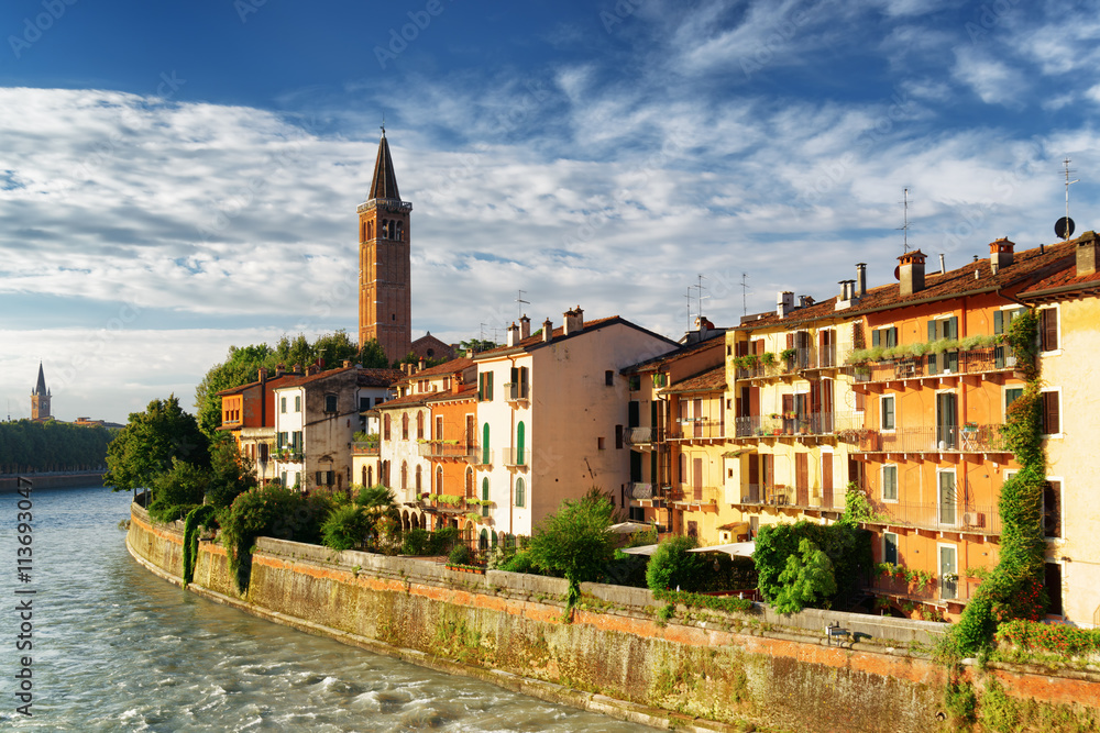 Facades of houses on waterfront of the Adige River in Verona