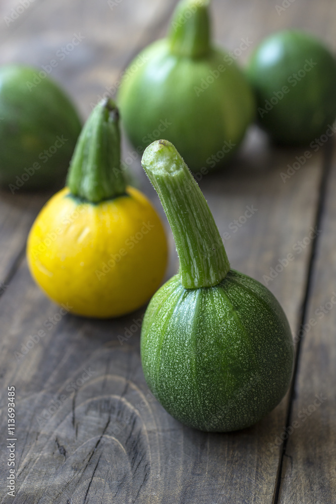 Fresh zucchini on wooden table Fresh zucchini on wooden table