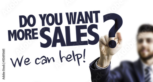 Business Man Pointing the Text: Do You Want More Sales? We Can Help! photo