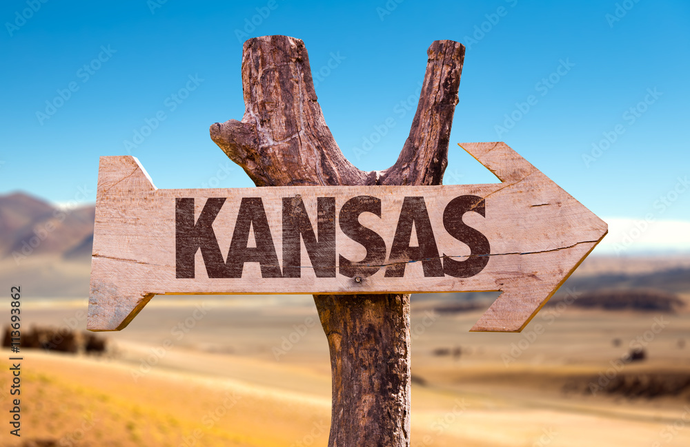 Kansas wooden sign with a desert background