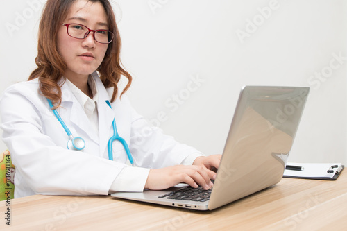 Asian female doctor at work