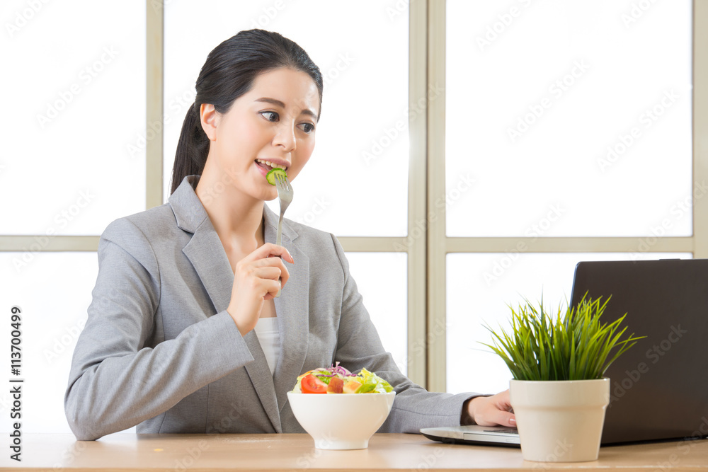 Young asian businesswoman enjoying a healthy salad Young asian businesswoman enjoying a healthy salad