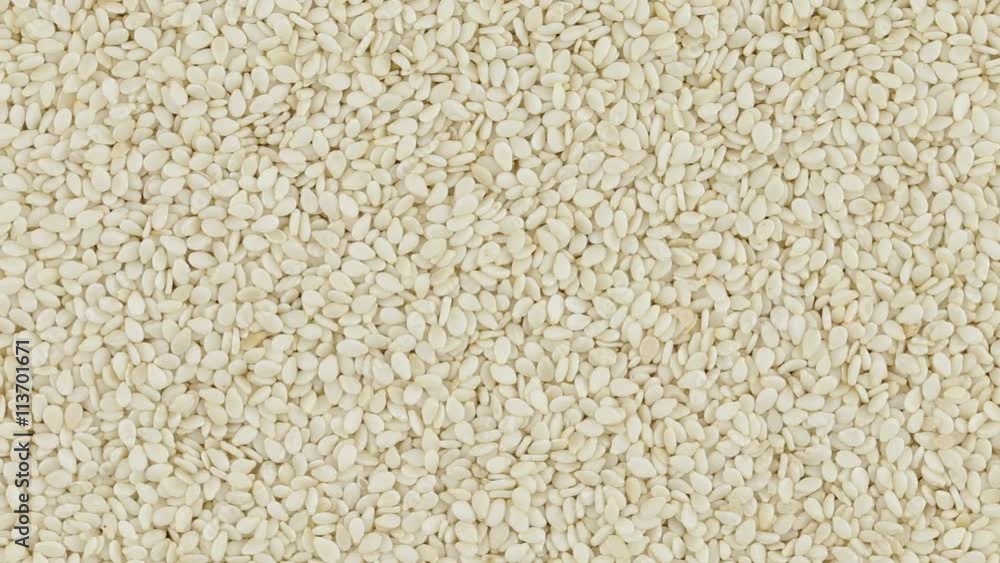 Sesame seeds close up. Loop rotation. Front of the camera rotates plate with sesame seeds Sesame seeds close up. Loop rotation. Front of the camera rotates plate with sesame seeds