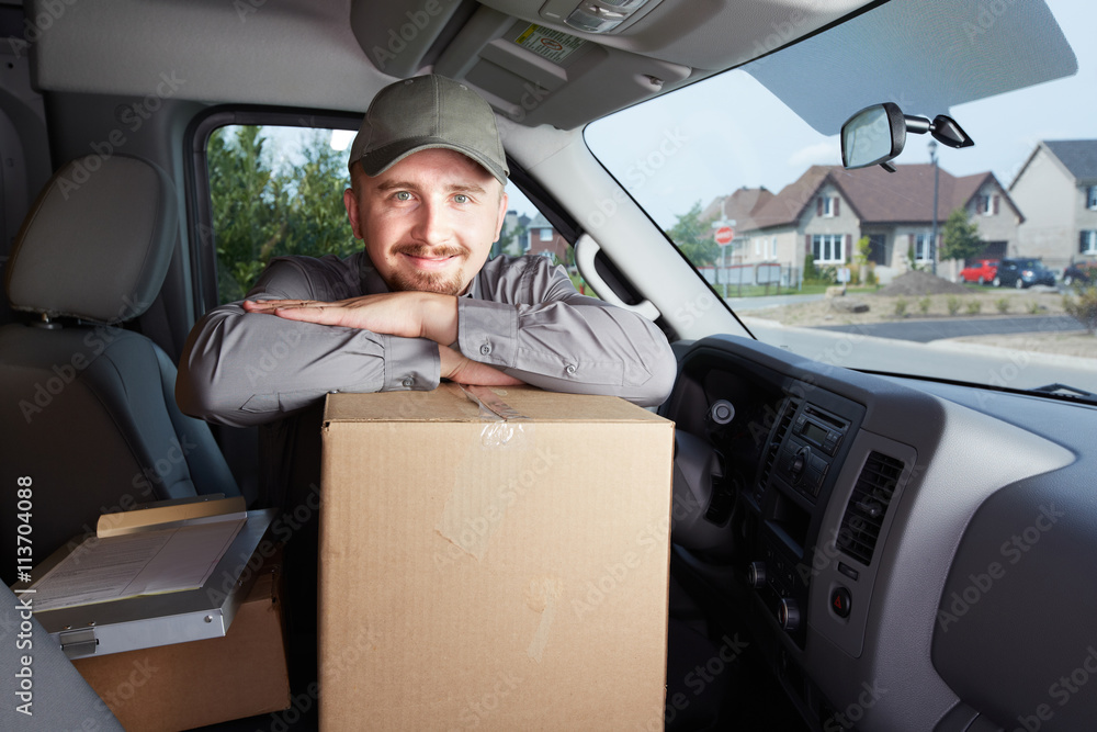 Young delivery man with a parcel. Young delivery man with a parcel.