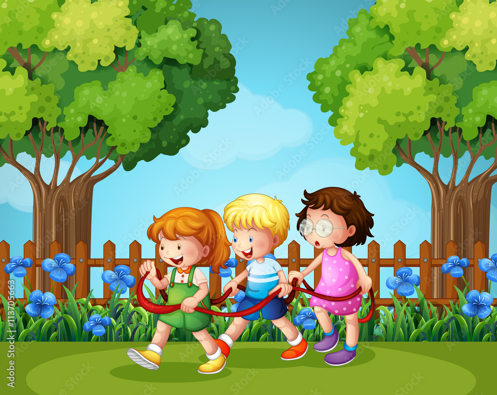 Three kids playing in the garden Three kids playing in the garden